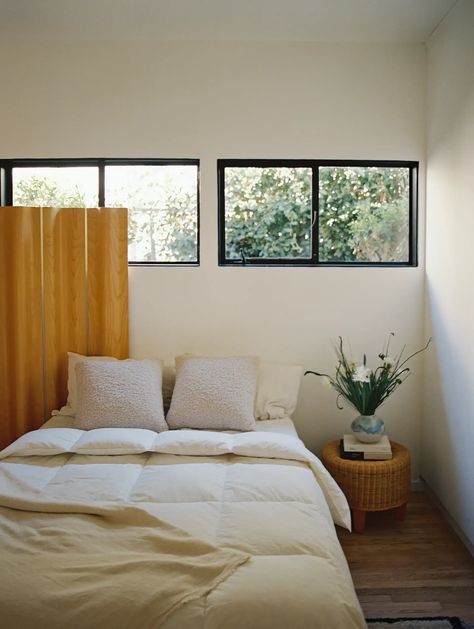 A room filled with lots of windows and plants on top of it's sides in the floor next to a wooden floor plan for a window filled with lots of a small house with lots of the side of